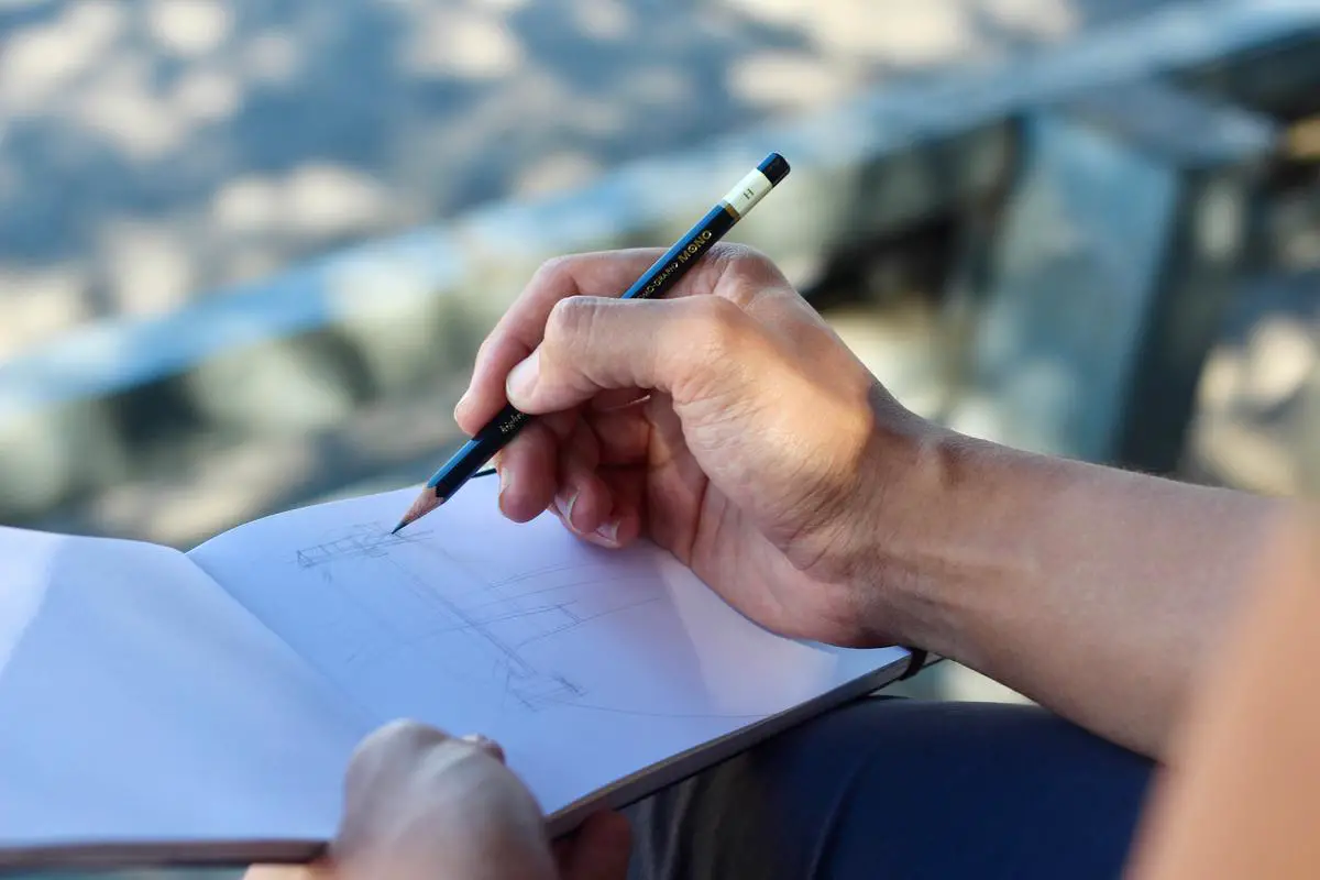 Illustration of a person sketching on a storyboard, representing the concept of understanding storyboards visually.